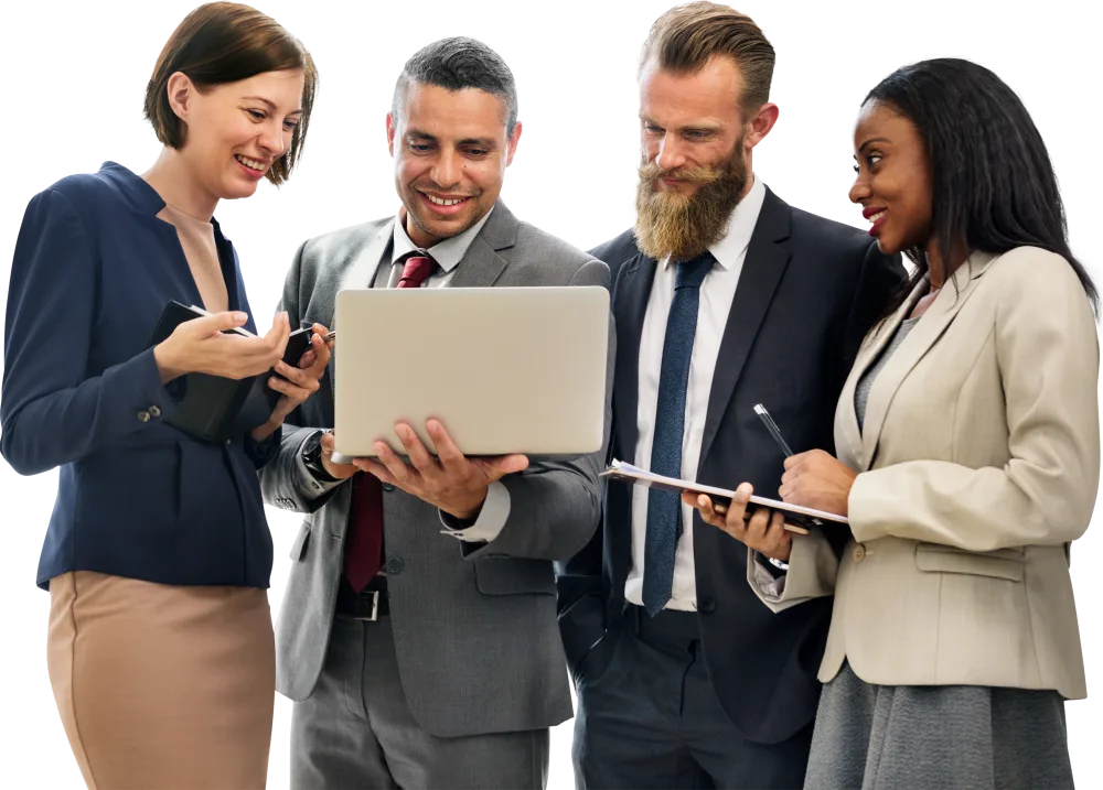 A team of professionals reviewing work together on a laptop