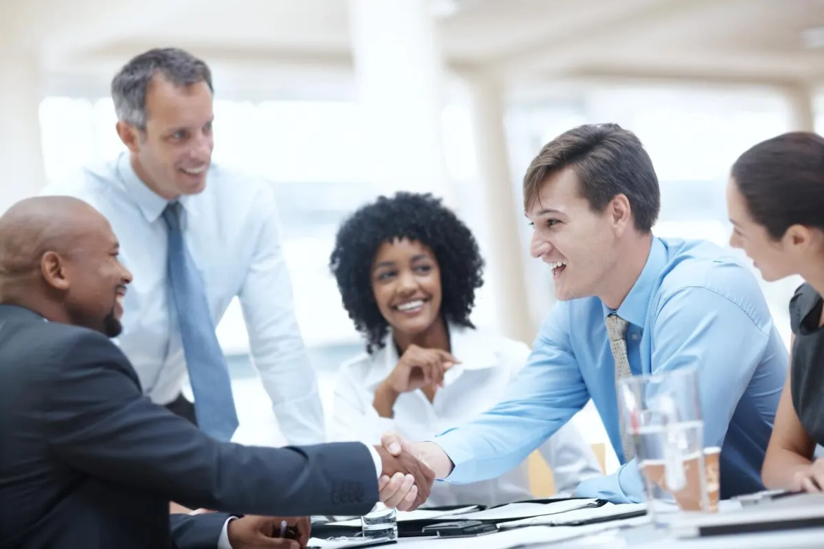 Business people shaking hands at a meeting
